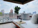 Balcony with outdoor seating and city view