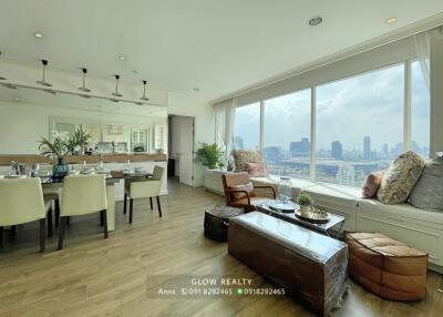Bright and spacious living and dining area with large windows offering city views