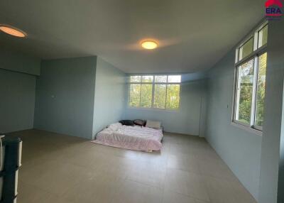 Spacious bedroom with large windows