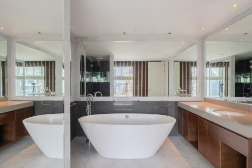 Modern bathroom with standalone bathtub and double sinks