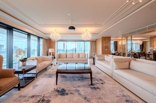 Spacious and elegantly designed living room with ample natural light and city views