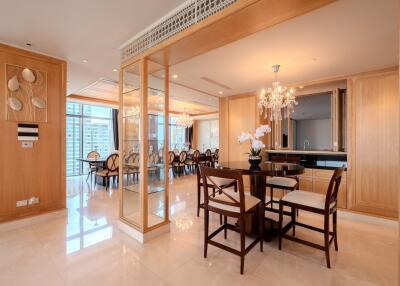 Modern dining room with large table and elegant chandelier
