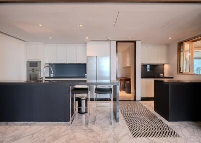 modern kitchen with island and marble flooring