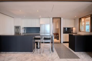 modern kitchen with island and marble flooring