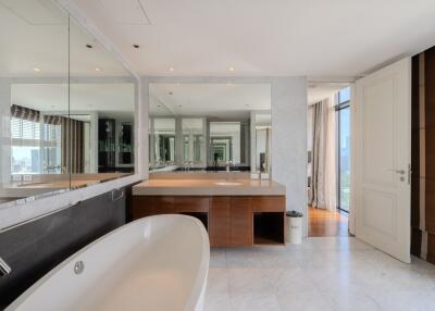 Spacious modern bathroom with vanity and large tub