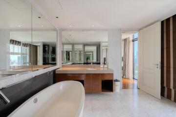 Spacious modern bathroom with vanity and large tub