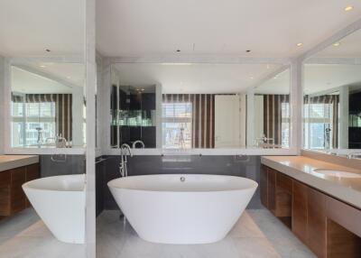 Luxurious modern bathroom with freestanding tub and double vanities