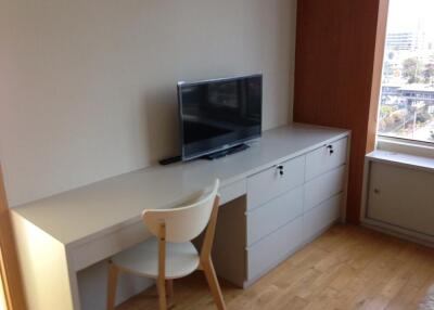 Bedroom with desk and TV