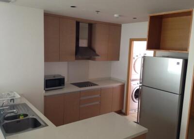 Modern kitchen with appliances and laundry area