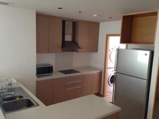 Modern kitchen with appliances and laundry area