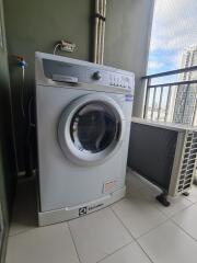 Laundry area with washing machine and outdoor AC unit