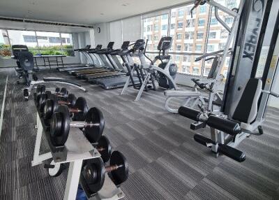 Modern fitness center with various gym equipment