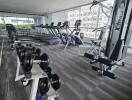 Modern fitness center with various gym equipment