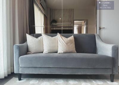 Modern living room with grey sofa