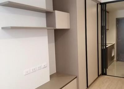 Modern bedroom with built-in wardrobe and shelves