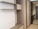 Modern bedroom with built-in wardrobe and shelves