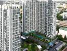 Aerial view of modern residential high-rise buildings with outdoor amenities