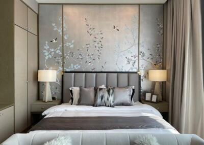 Modern bedroom with decorative wall art and cozy bedding