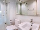 Modern bathroom with glass shower and mosaic tile accents