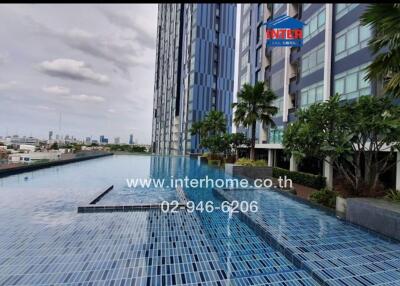 High-rise residential building with rooftop infinity pool