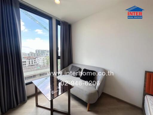 Living room with large window and view