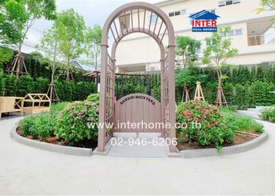 Beautiful garden area with an ornamental archway and landscaping