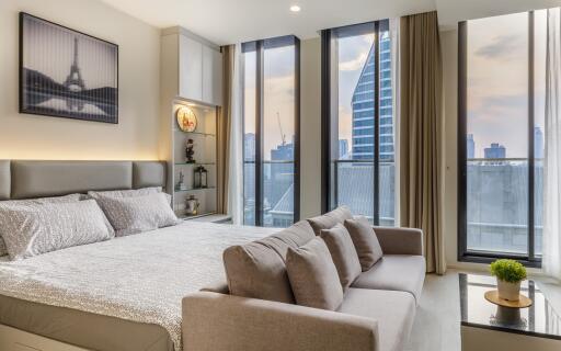 Modern and spacious bedroom with large windows