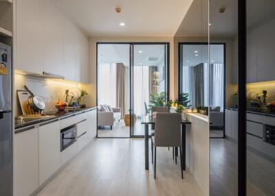 Modern kitchen with dining table and view of the living area