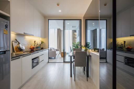 Modern kitchen with dining table and view of the living area