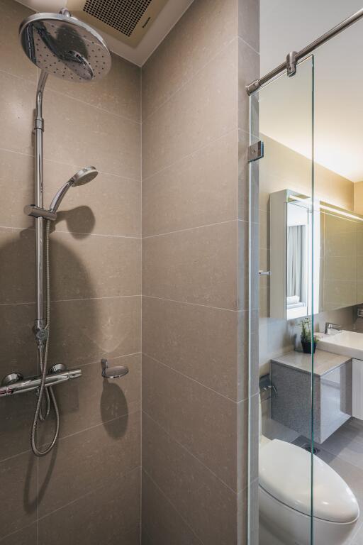 Modern bathroom with shower and glass partition