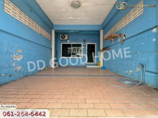 spacious garage with tiled floor and blue walls