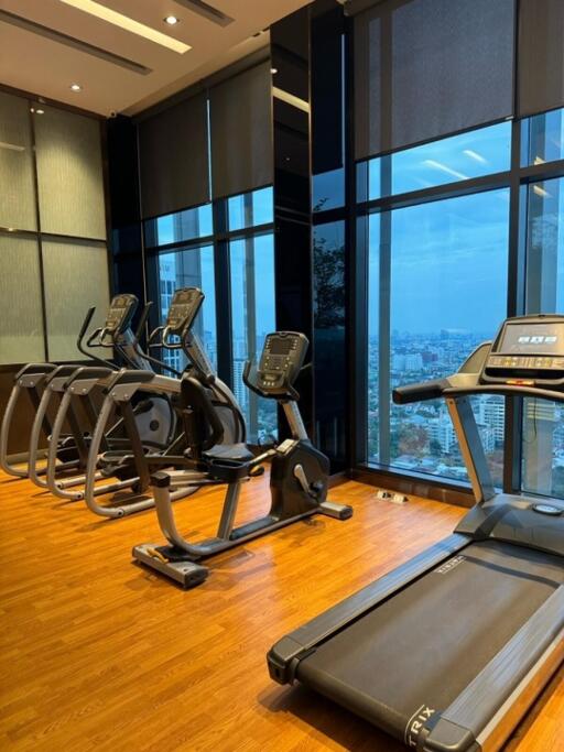 Modern gym with large windows and exercise equipment