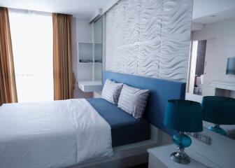 Modern bedroom with blue and white decor