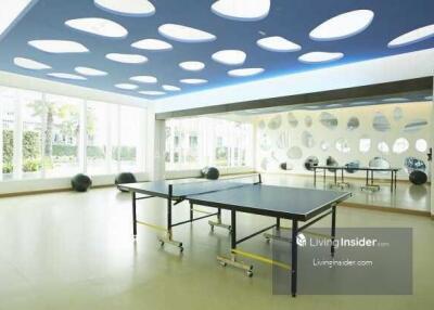 Spacious recreation room with table tennis