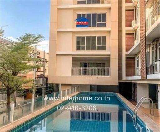 Swimming pool in front of an apartment building