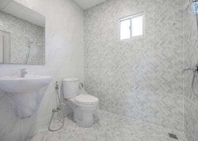 Modern bathroom with tiled walls and floor