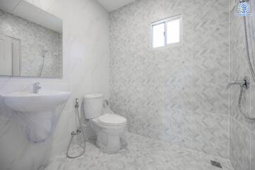 Modern bathroom with tiled walls and floor