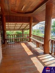 Spacious wooden balcony with a view