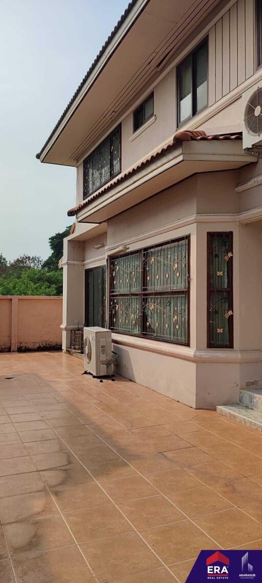 Front view of a residential building with tiled terrace