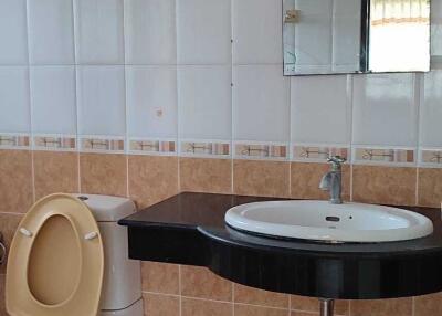 Bathroom with sink and toilet