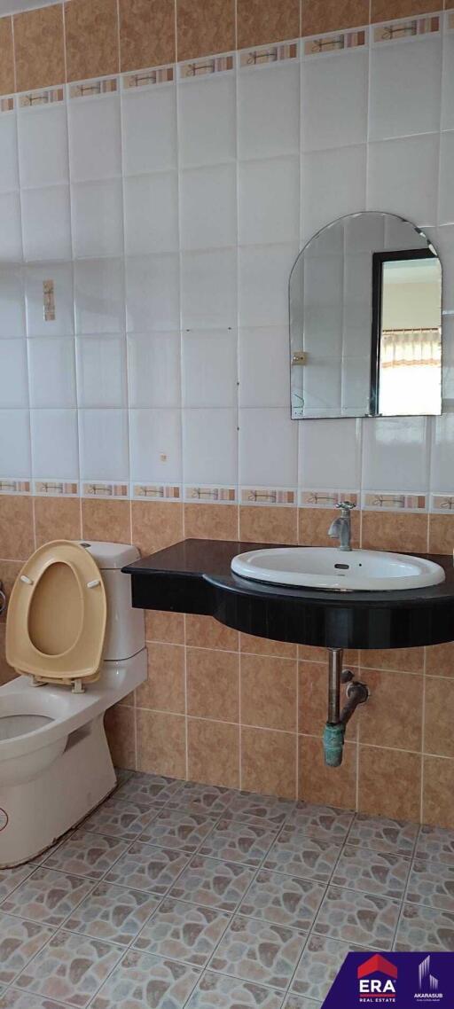 Bathroom with sink and toilet