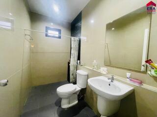 Modern bathroom with sanitary fittings and mirror