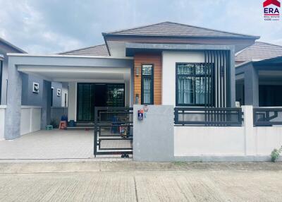 Front view of a house with a gated driveway