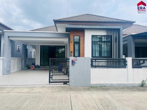 Front view of a house with a gated driveway