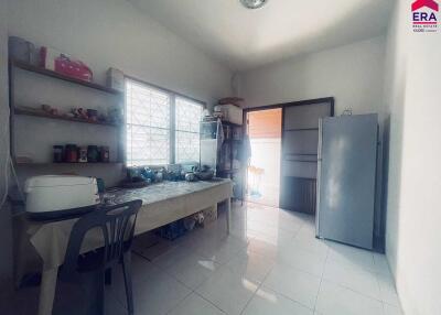 Spacious kitchen with ample lighting and storage space