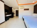 Modern bedroom with double beds, air conditioning, flat screen TV, and built-in furniture