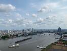 Panoramic view of a river with city buildings and boats