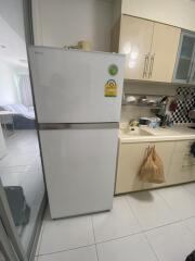 Kitchen area with refrigerator and counter