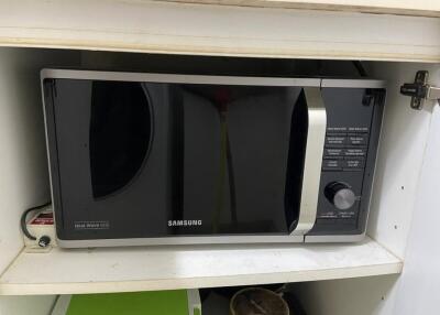 Microwave in kitchen cabinet