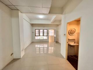 View of main living space with adjoining bathroom